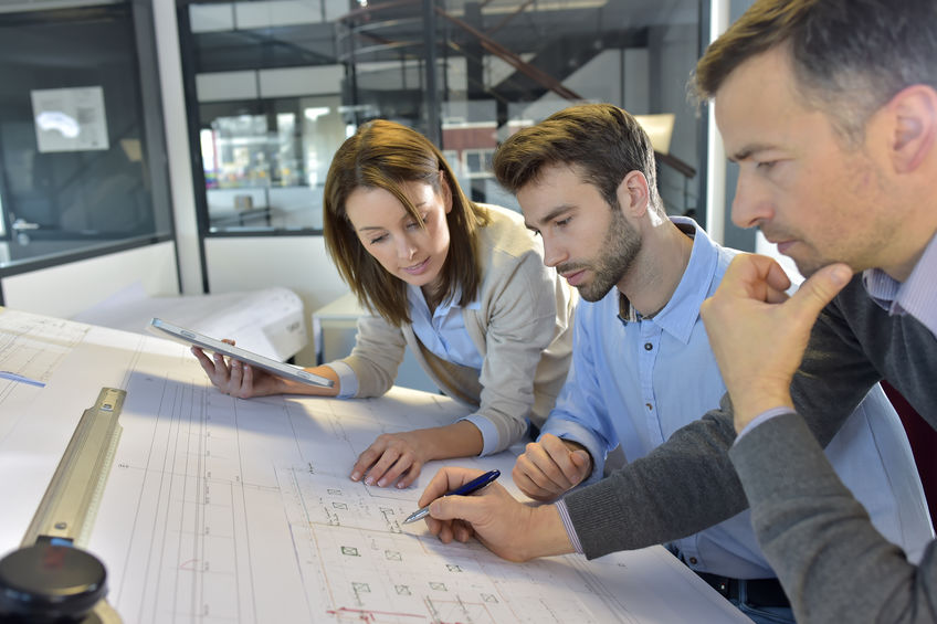 team of architects working on construction project